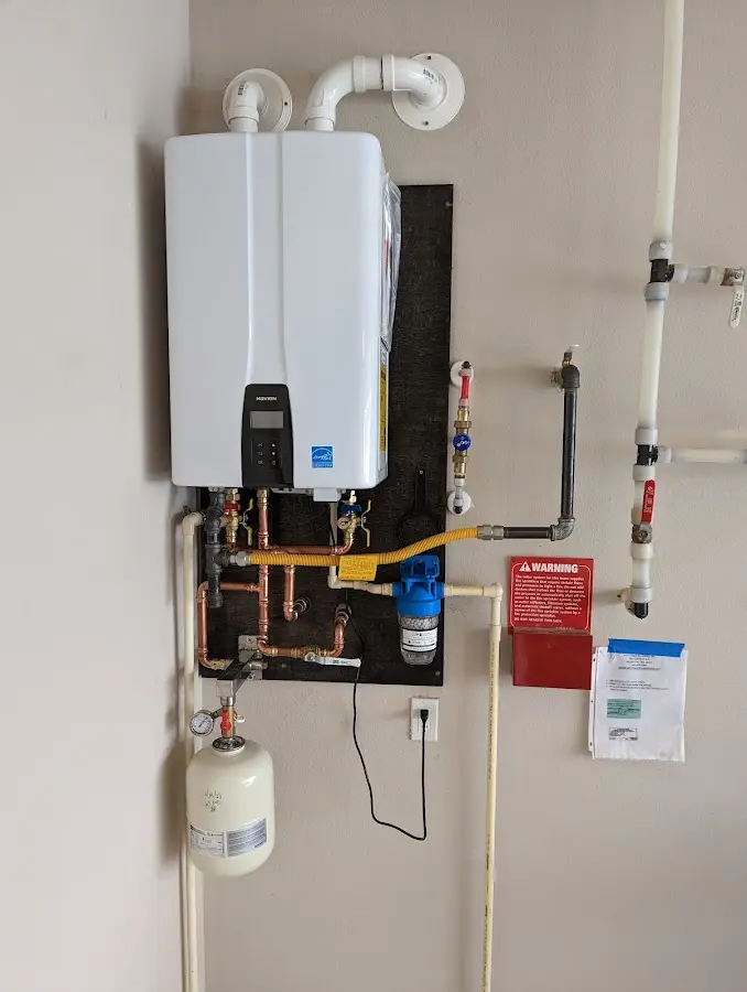 Professional plumber installing copper piping in a Sergeant Bluff home